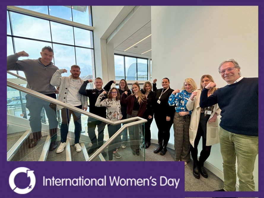 The team at Active Humber stand in solidarity this International Women's Day striking the strong arm pose.