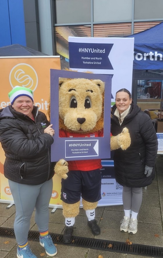 The Sport Welfare Officers from Active Humber and North Yorkshire Sport with a lion mascot at a Rugby match